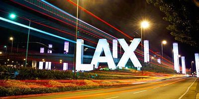 Nighttime light trails on a California trucking sign.