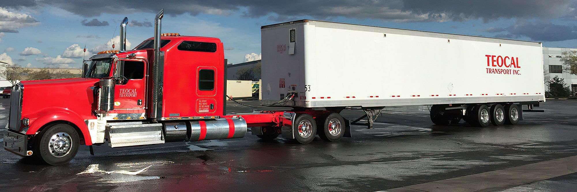 A California trucking company operating a red semi truck.